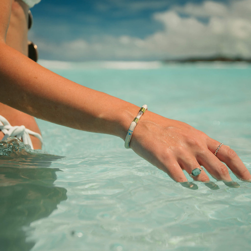 18k gold plated coral legend bracelet on a women's wrist