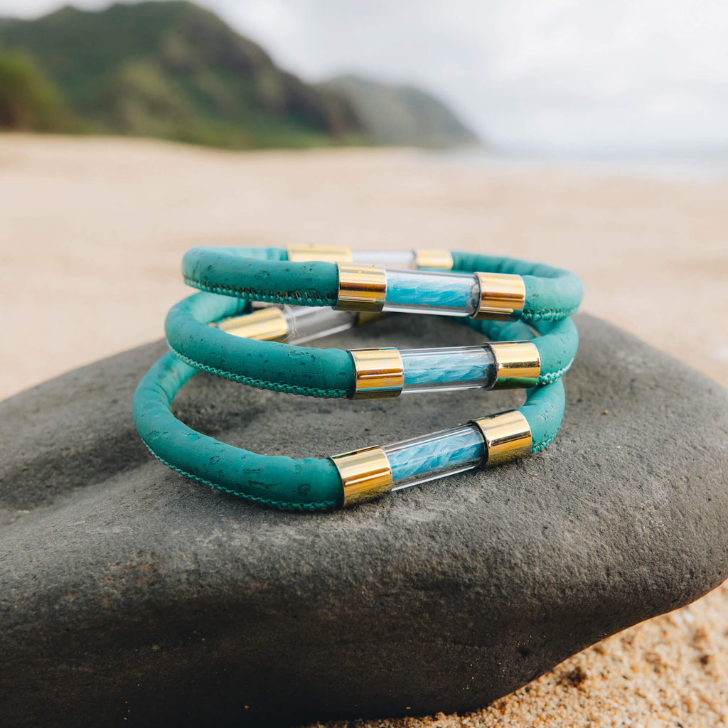 18k gold plated Sea Turtle Legend Bracelet on a rock